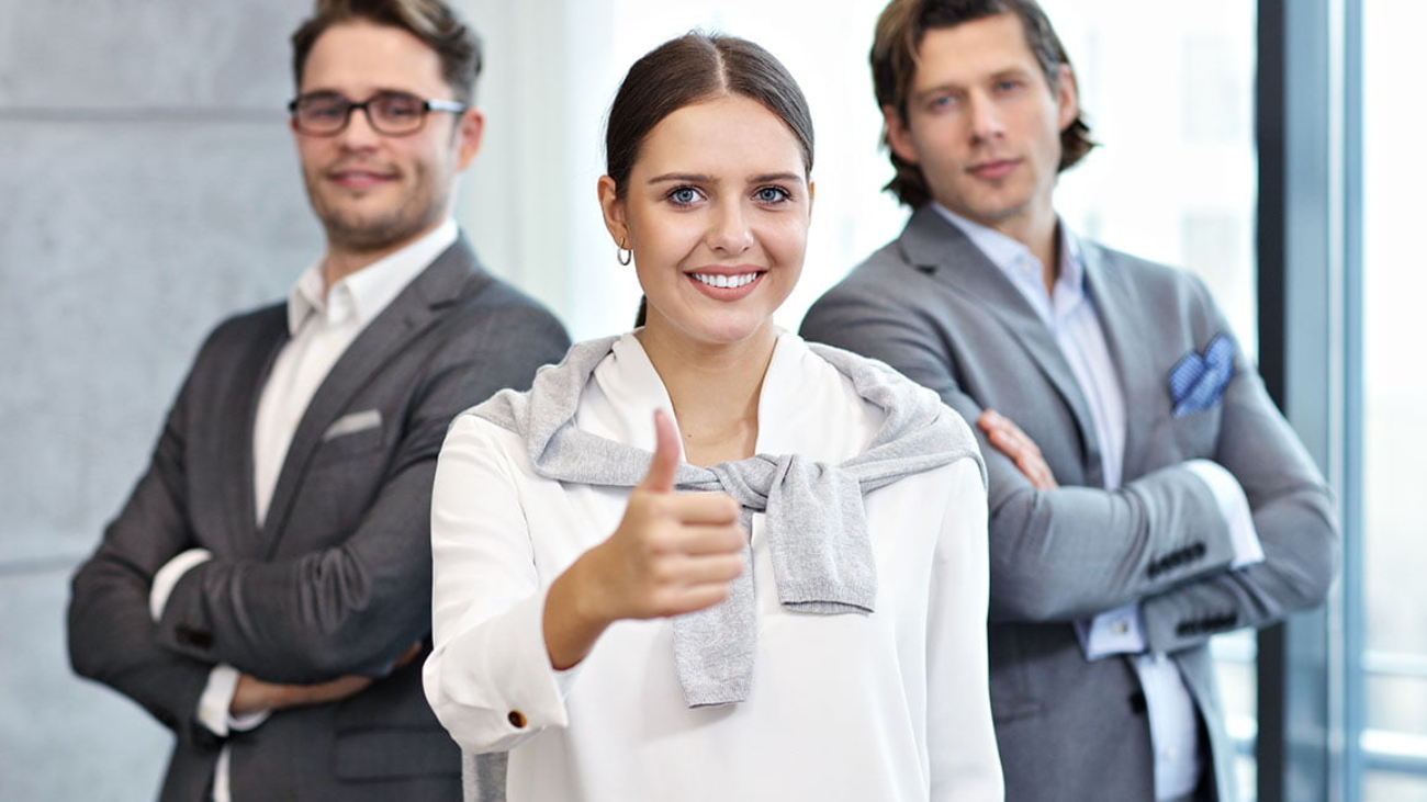 Group of business people sharing ideas in modern office